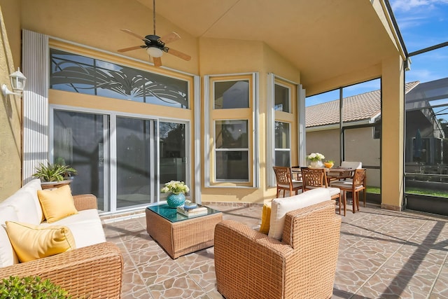view of patio / terrace featuring a ceiling fan, an outdoor hangout area, and a lanai