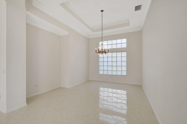 dining space with ornamental molding, a tray ceiling, a chandelier, and light hardwood / wood-style flooring