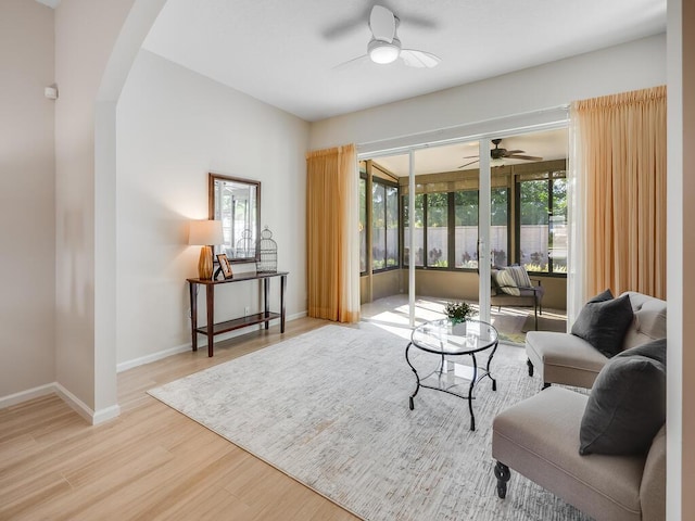 sitting room featuring ceiling fan and light hardwood / wood-style floors