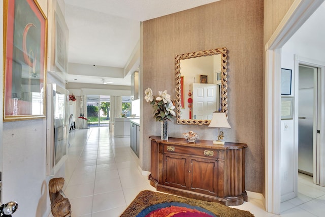 hall featuring light tile patterned flooring