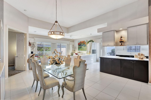 dining area with light tile patterned flooring