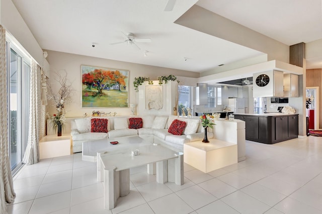 living room featuring ceiling fan and light tile patterned flooring