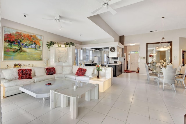 living room featuring light tile patterned floors and ceiling fan