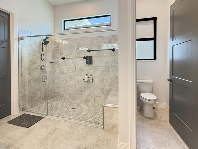 exercise room with light tile patterned floors and ceiling fan