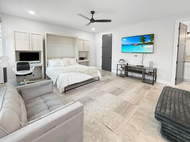 bedroom with ensuite bathroom and ceiling fan