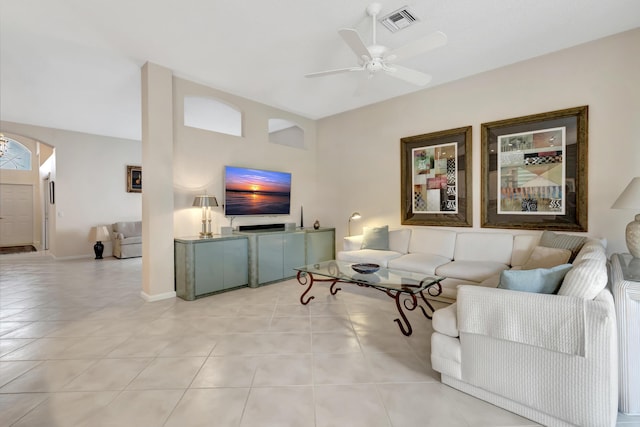 tiled living room featuring ceiling fan