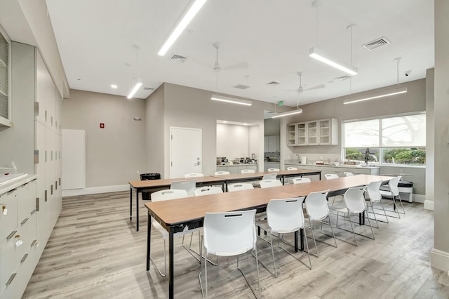 dining room with light wood-type flooring