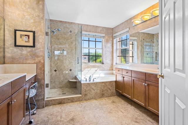 bathroom featuring shower with separate bathtub and vanity