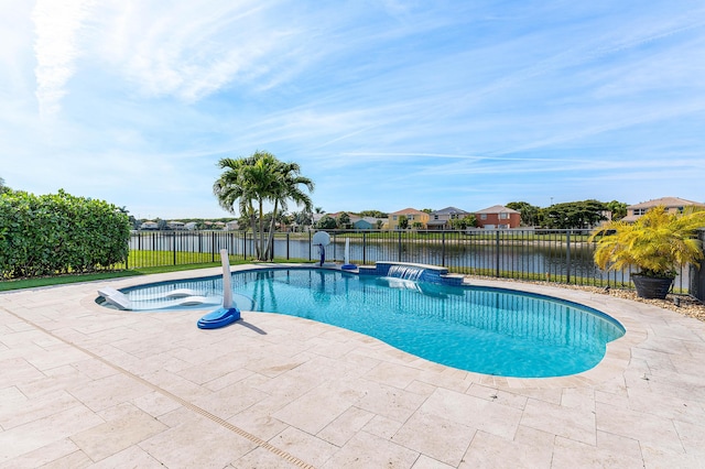 view of swimming pool featuring a patio area and a water view