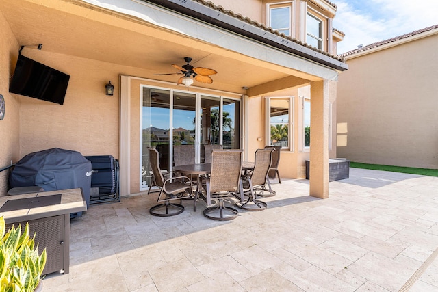 view of patio featuring ceiling fan and grilling area