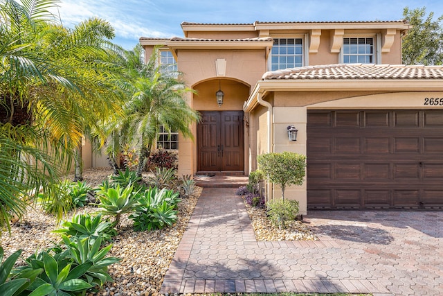 doorway to property featuring a garage