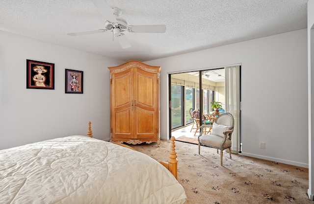 carpeted bedroom with ceiling fan, access to outside, and a textured ceiling