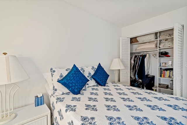 bedroom featuring a closet and a textured ceiling