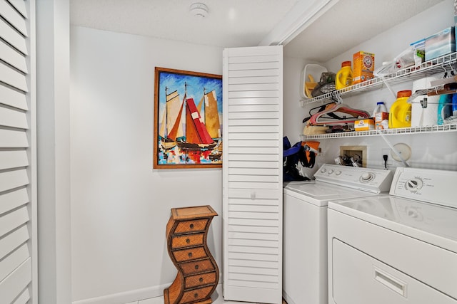 laundry room featuring washing machine and clothes dryer