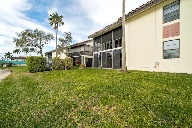 view of yard featuring a sunroom