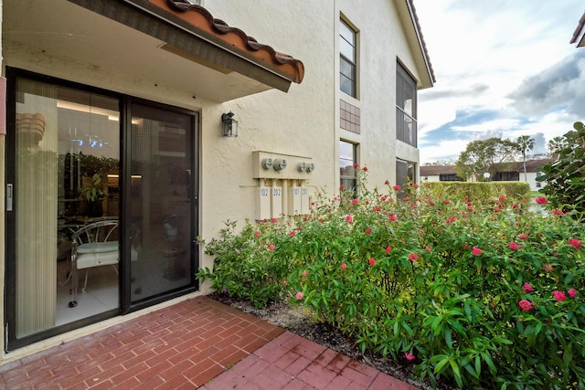 entrance to property with a patio