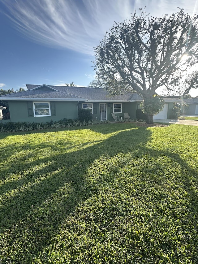 ranch-style house with a front lawn