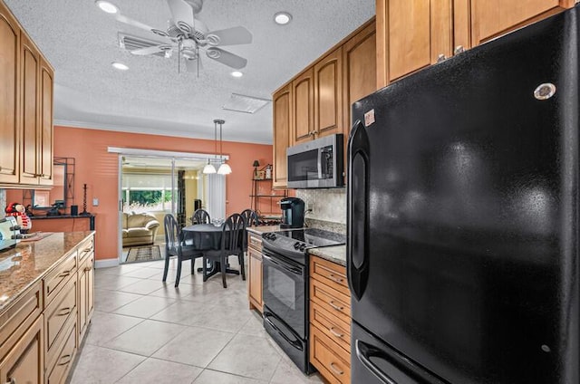 kitchen featuring light stone counters, a textured ceiling, light tile patterned floors, hanging light fixtures, and black appliances