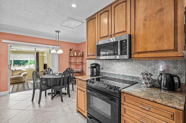 kitchen with hanging light fixtures, ornamental molding, light stone countertops, black / electric stove, and decorative backsplash