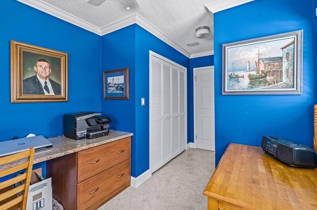 home office with ceiling fan, ornamental molding, and a textured ceiling