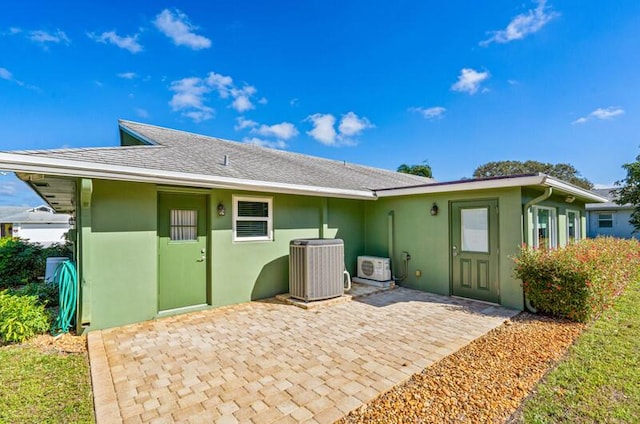 back of house featuring a patio and cooling unit