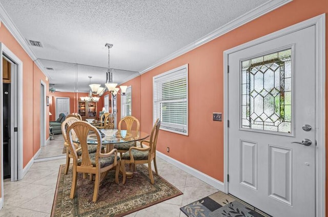 tiled dining area with crown molding, a textured ceiling, and a chandelier