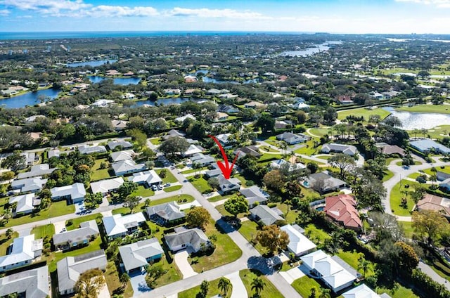 birds eye view of property featuring a water view