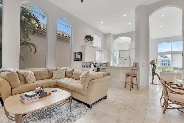 living room with a towering ceiling