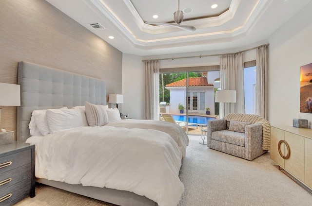 bedroom featuring light carpet, crown molding, access to outside, and a raised ceiling