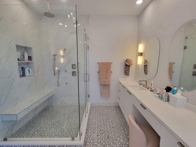 bathroom with vanity and an enclosed shower