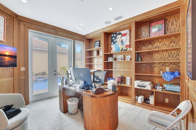 office space featuring wooden walls and french doors