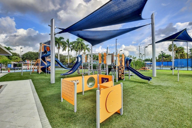 view of playground featuring a lawn