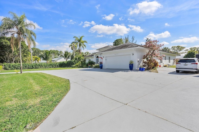 view of front of home with a garage and a front yard