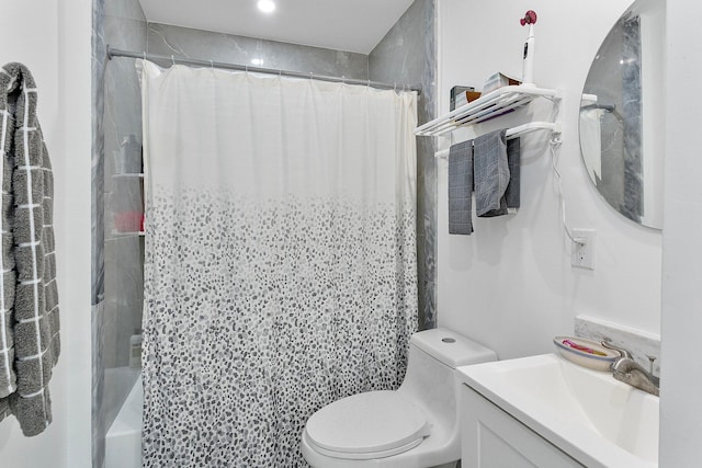 bathroom featuring vanity, walk in shower, and toilet