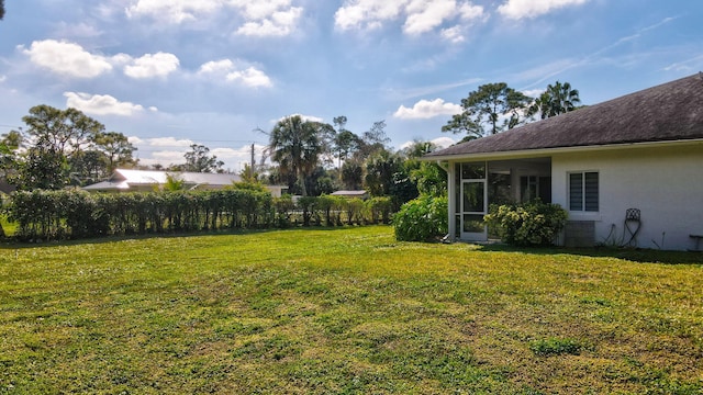 view of yard with a sunroom