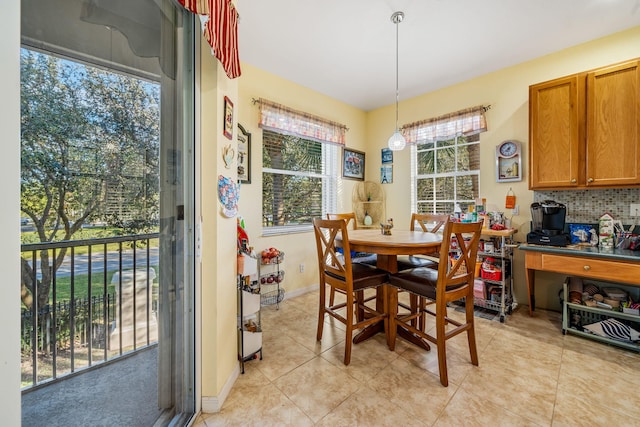 dining space with plenty of natural light and light tile patterned flooring