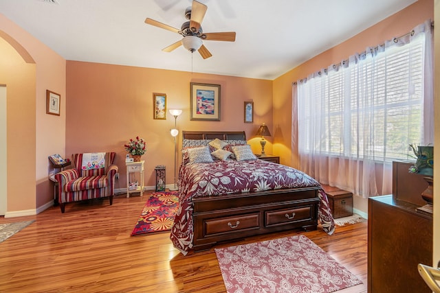 bedroom with ceiling fan and light wood-type flooring