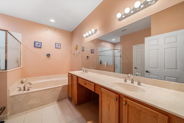 bathroom featuring vanity, independent shower and bath, and tile patterned flooring