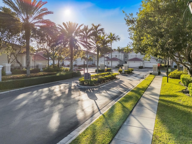 view of property's community featuring a yard