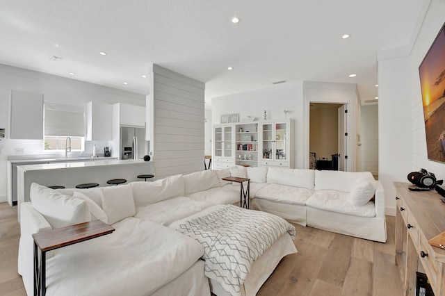 living room with light hardwood / wood-style flooring