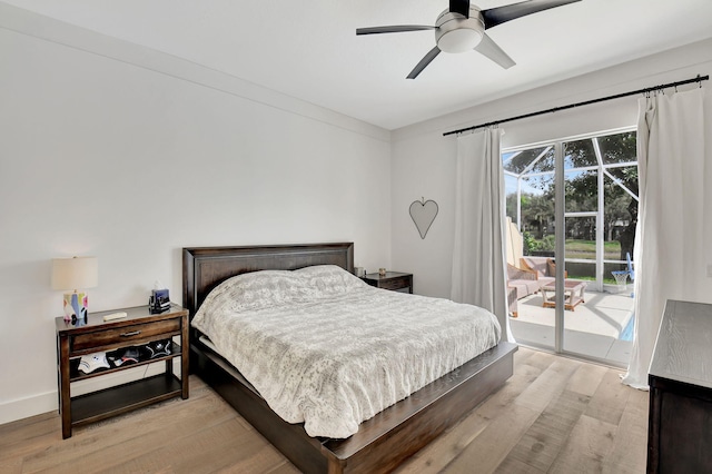 bedroom featuring access to outside, ceiling fan, and light hardwood / wood-style flooring