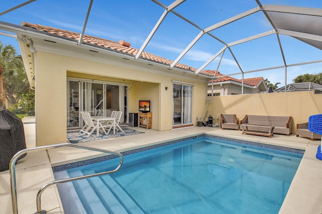 view of pool with a lanai and a patio area