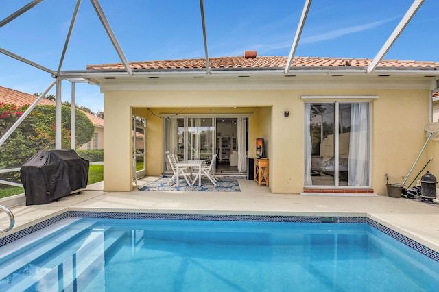 back of property with a lanai and a patio