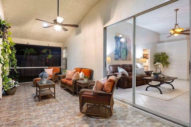 interior space with high vaulted ceiling and ceiling fan