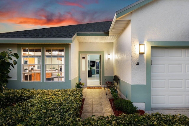 property entrance with a garage