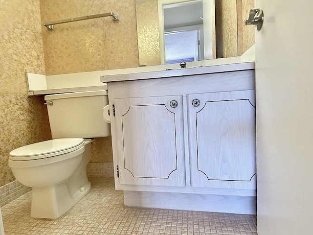 bathroom with tile patterned floors, vanity, and toilet