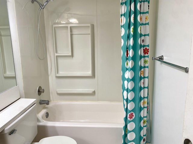 bathroom featuring shower / bath combo and toilet