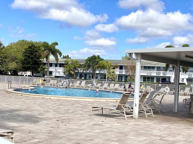 view of swimming pool featuring a patio area