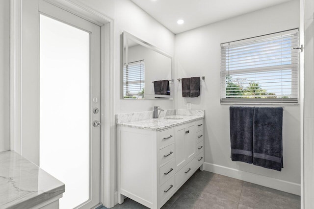 bathroom with vanity and tile patterned flooring