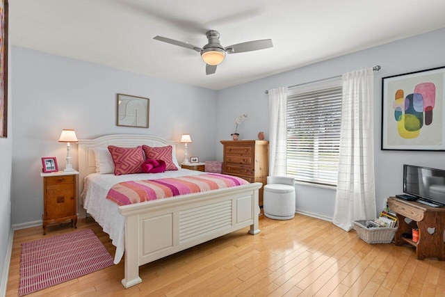 bedroom with ceiling fan and light wood-type flooring